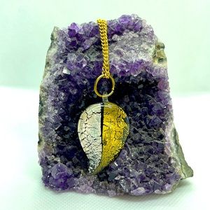 Gold and silver colored leaf pendant